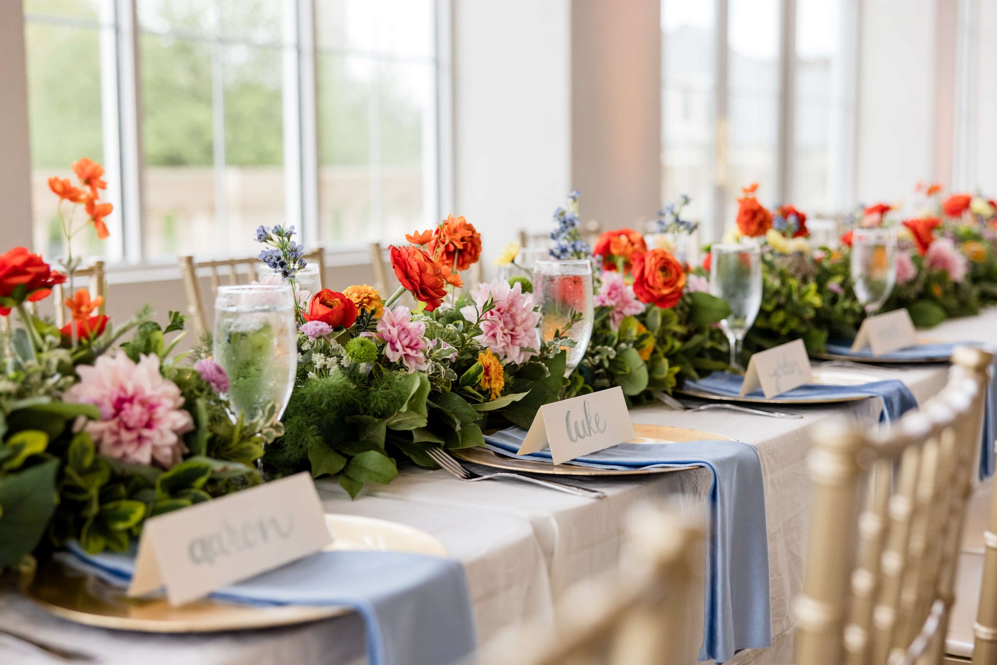 Garden-inspired-wedding centerpieces-styled-along-a reception-table